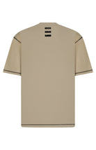 Beige t-shirt with black accents on a white background
